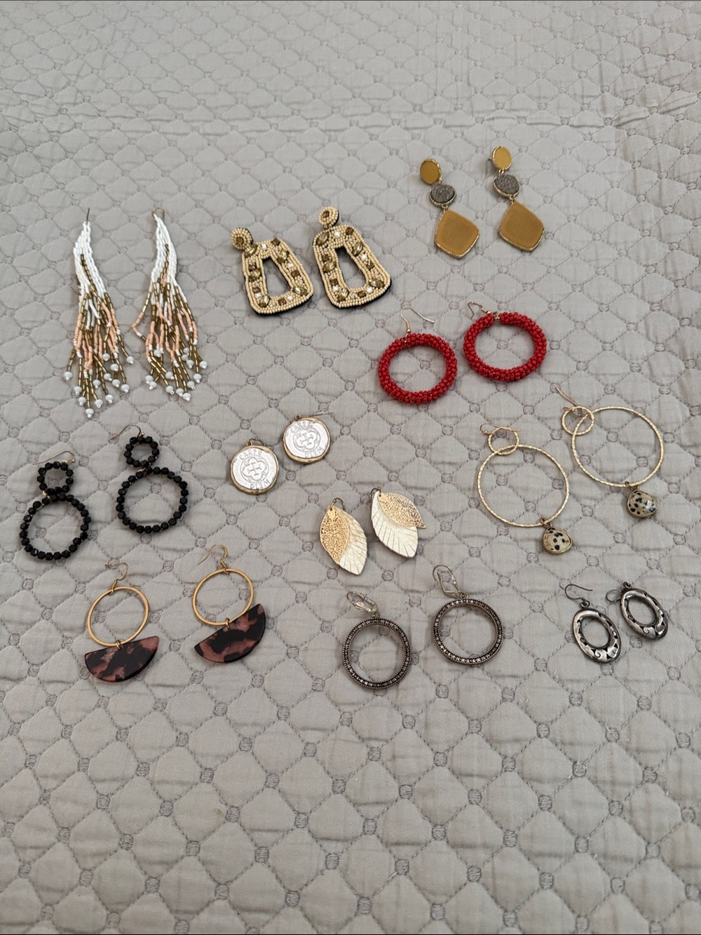 Bundle of costume jewelry. Some do not have backings.